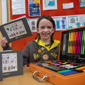 Amelia with her winning card and art set