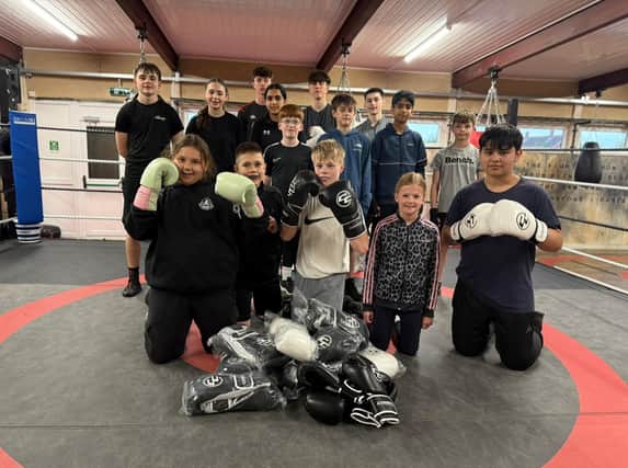 Youngsters at a community boxing gym in Leamington are boxing clever following the donation of gloves worth £2,000. The 40 pairs of Velcro boxing gloves were recently presented to Cleary’s Boxing Gym in Leamington by Combat Co. based in Bishops Tachbrook. Picture supplied
