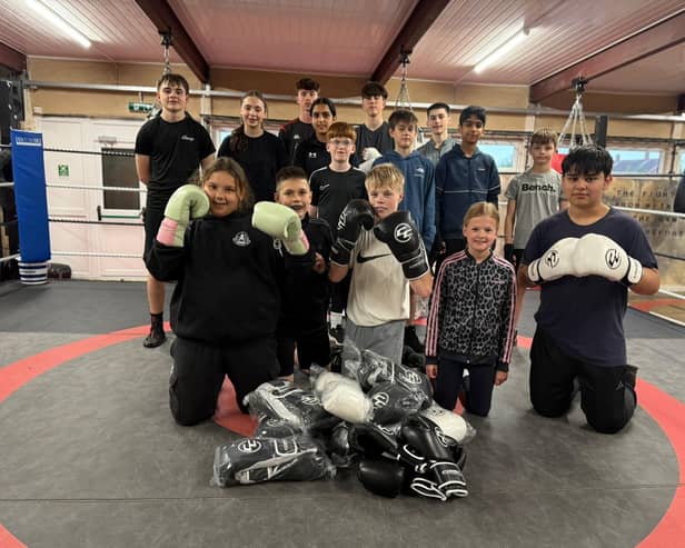 Youngsters at a community boxing gym in Leamington are boxing clever following the donation of gloves worth £2,000. The 40 pairs of Velcro boxing gloves were recently presented to Cleary’s Boxing Gym in Leamington by Combat Co. based in Bishops Tachbrook. Picture supplied