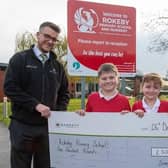 Dan presents the cheque for £500 to Rokeby Primary School