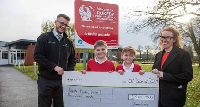 Dan presents the cheque for £500 to Rokeby Primary School