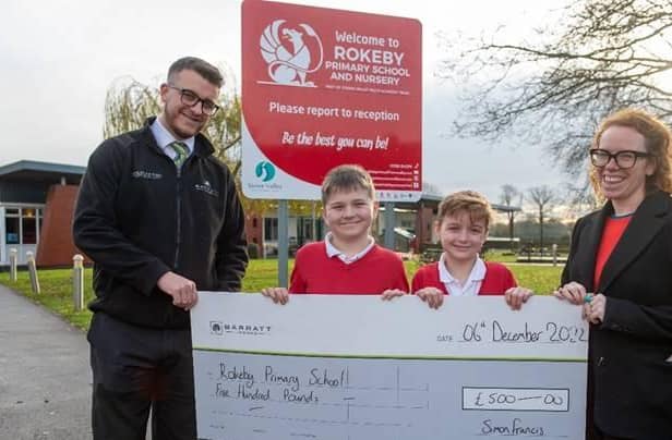 Dan presents the cheque for £500 to Rokeby Primary School