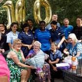 Vera Shepherd surrounded by family and staff in the garden at Kineton Manor