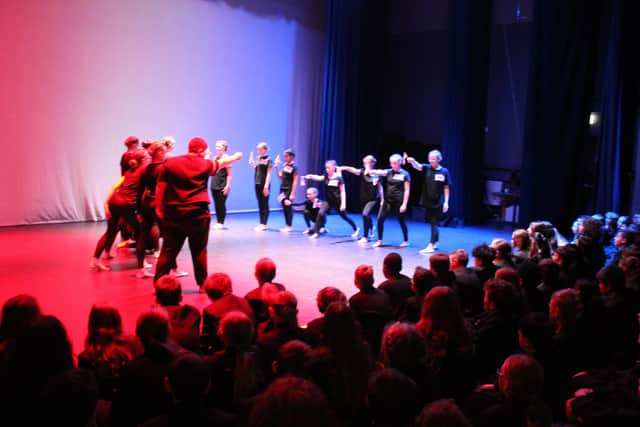 Students watch a dance performance in the Remembrance assembley.