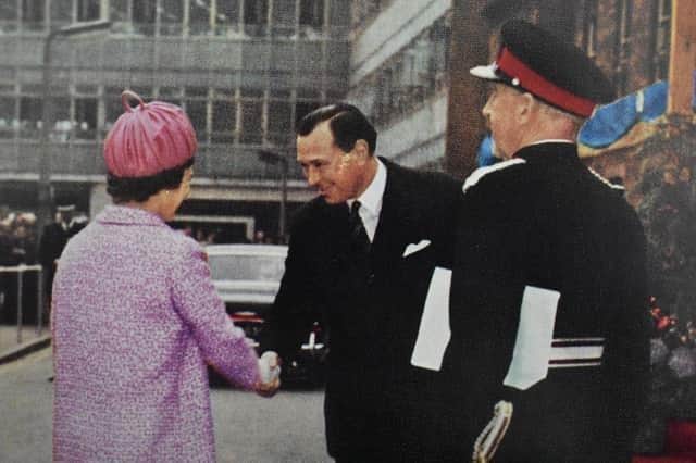The Queen arrives at the works.