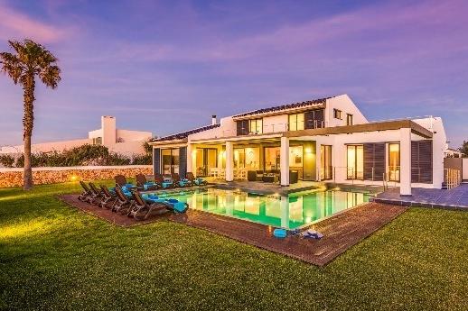 The spacious, stylish interiors of Villa Sea View are ideal for large groups to enjoy both sophistication and amusement.
Located in a residential area of Sa Caleta, the villa is just a ten minute walk from a selection of restaurants and a pretty cove.
There is plenty of outdoor space to enjoy the long, sunny days and the luxurious, L-shaped, saltwater pool is surrounded by wooden decking and sun loungers perfect for baking in the Spanish sun. Guests can enjoy a Love Island-inspired cocktails evening under the shaded terrace with comfortable seating.
PRICE: £2,901 (£41.44pppn)* for seven nights’ self-catered accommodation arriving Friday, 2nd September. Sleeps up to ten in five bedrooms.