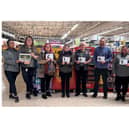 Morrisons staff members Charlotte, Alex, Hayley, Chris and Daisy with Susan and volunteers from the LWS Night Shelter. Photo supplied