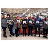 Morrisons staff members Charlotte, Alex, Hayley, Chris and Daisy with Susan and volunteers from the LWS Night Shelter. Photo supplied