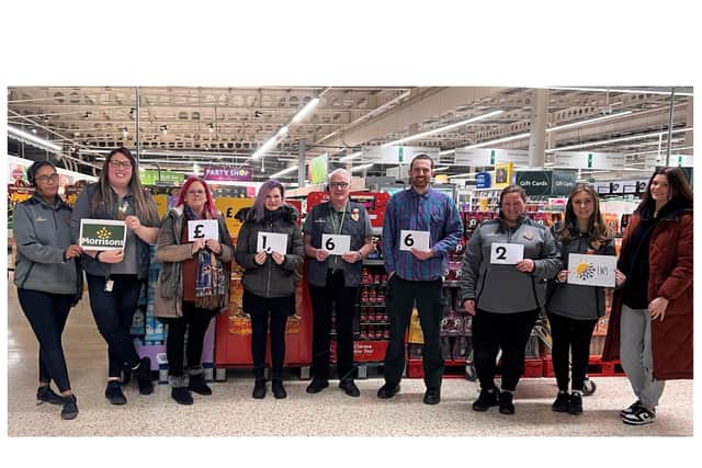 Morrisons staff members Charlotte, Alex, Hayley, Chris and Daisy with Susan and volunteers from the LWS Night Shelter. Photo supplied