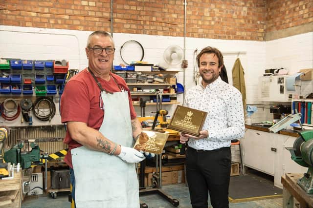 Andrew Holloway and Darren Coleborn from the Engineering, Design and Prototyping team at Defence Munition site Kineton, who created the plaques in their workshop