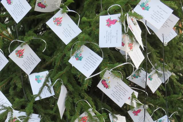 The dedications are placed on the tree and remain there until the New Year. Photo supplied