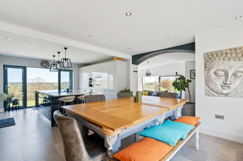 The open plan kitchen/dining room. Photo by DM & Co. Homes