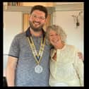 Leamington Rotary Club president Ataberk Keskisoglu with outgoing president Linda John. Picture supplied.