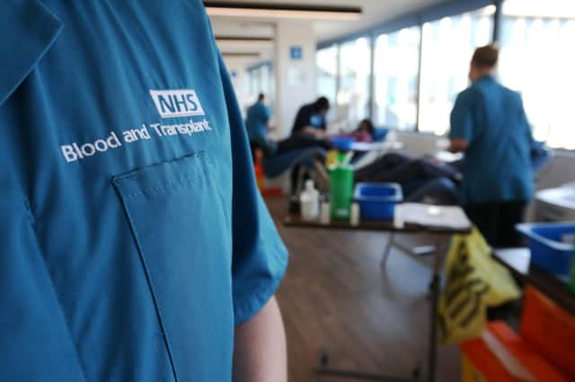 A donor carer's branded uniform at the Twickenham Donor Centre, south-west London, after a ban on the procedure was lifted in February. The ban was originally imposed in 1998 amid concerns about the spread of a human variant of BSE â€“ dubbed "mad cow disease" â€“ known as Creutzfeldt Jakob Disease. Picture date: Wednesday April 7, 2021. PA Photo. The plasma will be fractionated and used to make antibody-based medicines, called immunoglobulins, for people with rare immune diseases. NHS Blood and Transplant will from today take donations at 14 donor centres around England for an initial three months. Thousands of patients rely on immunoglobulin medicines for short-term or lifelong diseases and genetic disorders. See PA story HEALTH Plasma. Photo credit should read: Jonathan Brady/PA Wire