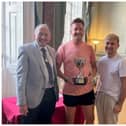 Overall Winners – Ryan and Paul Collier, holders of plot 18 at Railwayside, pictured with their trophy and the Deputy Mayor, Councillor Dave Skinner. Photo by Warwick Town Council
