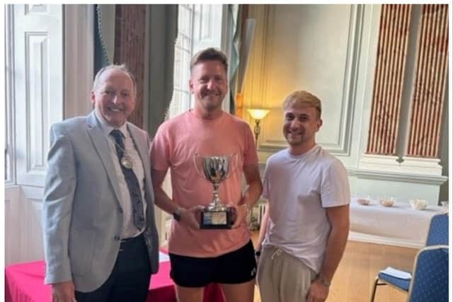 Overall Winners – Ryan and Paul Collier, holders of plot 18 at Railwayside, pictured with their trophy and the Deputy Mayor, Councillor Dave Skinner. Photo by Warwick Town Council