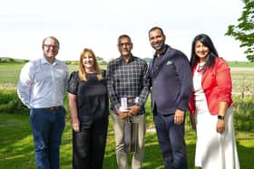 Shai Patel (C) pictured with some of the Walfinch team
