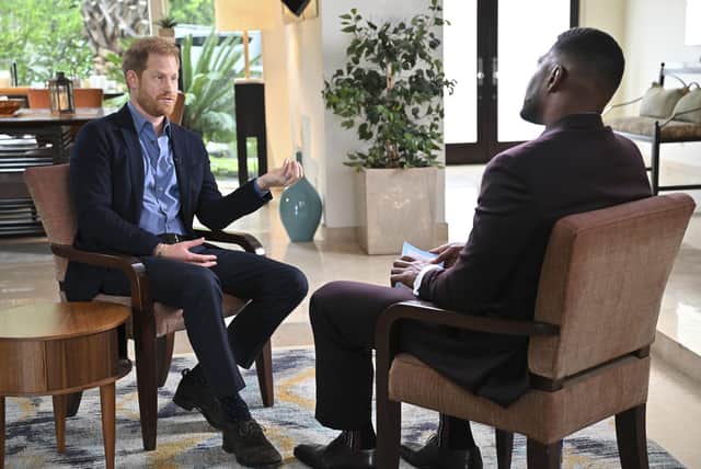 This image released by ABC shows Prince Harry, left, during an interview with "Good Morning America" co-host Michael Strahan in Los Angeles