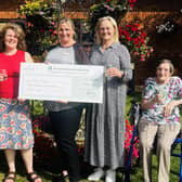 Cubbington Mill owner Barchester's Charitable Foundation has presented a cheque for £1,900 to Art Uplift to support it in bringing its Rewind-1970s show to communities of elderly and vulnerable people. Picture supplied.