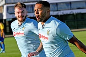 Jordan Wilson celebrates after he came off the bench to open the scoring for Rugby Town in their 2-0 win at Wellingborough Town. Picture by Martin Pulley