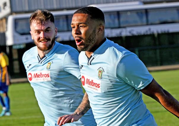 Jordan Wilson celebrates after he came off the bench to open the scoring for Rugby Town in their 2-0 win at Wellingborough Town. Picture by Martin Pulley