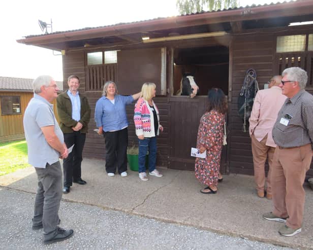 Members of the Warwick Rotary Club recently visited the Riding for the Disabled (RDA) head office and training centre in Shrewley, where they were given a talk and a tour of
the facilities. Photo supplied