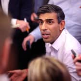 Prime Minister Rishi Sunak holds a "huddle" press conference with political journalists on board a Government plane as he heads to Bali, in Indonesia to attend the G20 summit. Picture date: Sunday November 13, 2022.