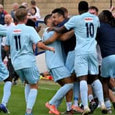 Rugby Town celebrate Drew Kear's goal in the 3-3 draw with Grantham Town at the weekend before Valley finished the job with a 1-0 success after extra-time in Tuesday's replay. Picture by Martin Pulley