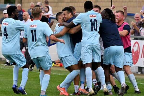 Rugby Town celebrate Drew Kear's goal in the 3-3 draw with Grantham Town at the weekend before Valley finished the job with a 1-0 success after extra-time in Tuesday's replay. Picture by Martin Pulley