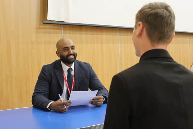 A student being interviewed by one of the Barclays volunteers