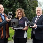 From left: Steve Tipson, Gina Reinge and Cllr Martin Watson with a pair of Apos shoes