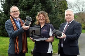 From left: Steve Tipson, Gina Reinge and Cllr Martin Watson with a pair of Apos shoes