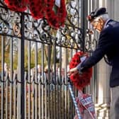 A library picture of a Rugby veteran at the war memorial gates