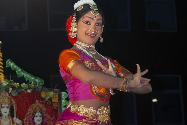 Entertaining with a colourful dance show.