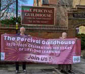 Guildhouse Centenary Committee Chairman, David Dove and Centre Manager Sarah Gall with the banner celebrating 100 years of adult education in Rugby.