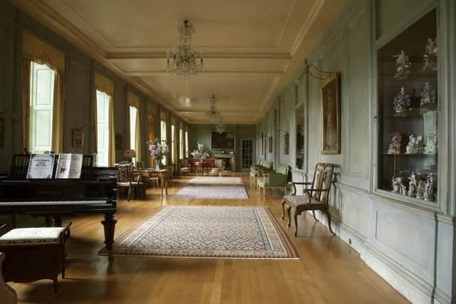 The Long Gallery from near the Dining Room, with ceramic cabinets on the right.