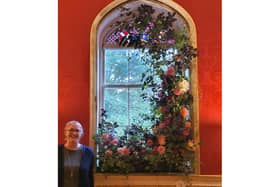 Nicola Hill with her floral window creation. Photo supplied