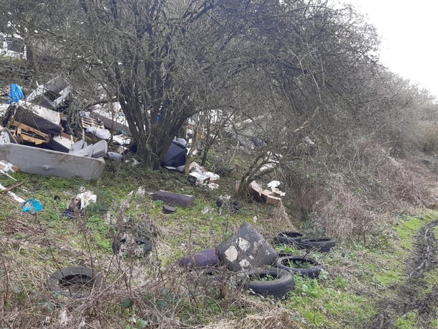 Criminals have created a huge fly-tipping site near Rugby along the old Lias Line.