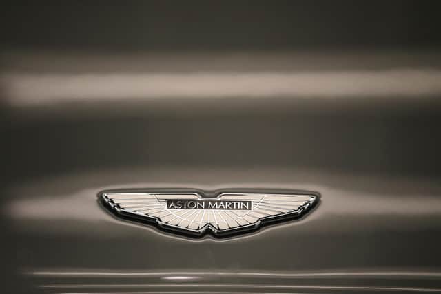 GAYDON, ENGLAND - JANUARY 10:  An Aston Martin logo known as the 'Wings' adorns the bonnet of a Vanquish at the company headquarters and production plant on January 10, 2013 in Gaydon, England. The iconic British brand is celebrating its 100th anniversary. Lionel Martin and Robert Bamford created Bamford & Martin on January 15 1913, which later became Aston Martin in honour of Bamford’s wins at the Aston Clinton Hillclimb in Buckinghamshire.  (Photo by Christopher Furlong/Getty Images)