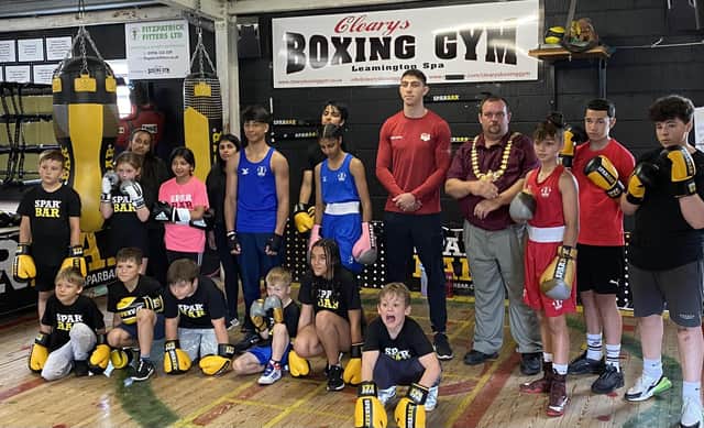 Cleary's Boxing Gym boxers including Birmingham 2022 Commonwealth Games gold medallist Lewis Williams (in red) with Leamington Mayor Cllr Nick Wilkins.