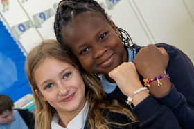 Two students at Lighthorne Heath Primary School with their friendship bracelets