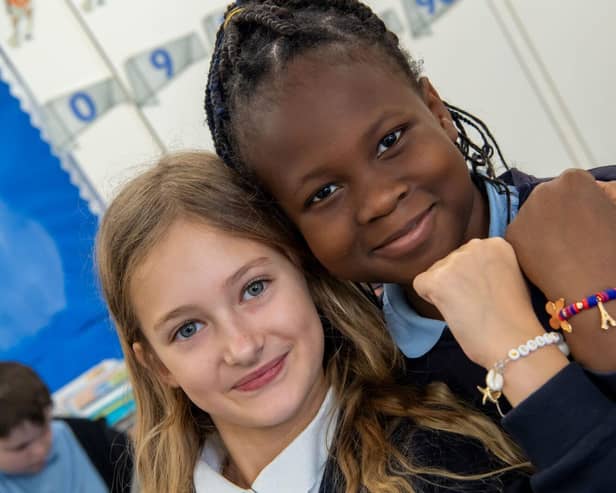 Two students at Lighthorne Heath Primary School with their friendship bracelets