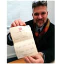 Charles Hansons with the childhood letter from Prince Charles. Photo by Hansons