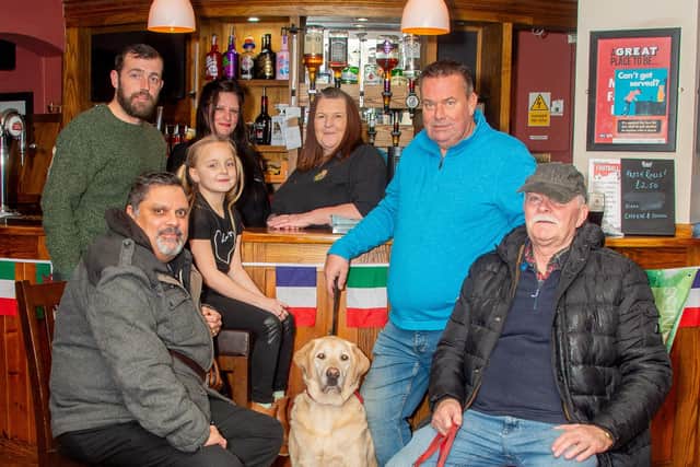 Siobhan Bermingham, the landlady of the Fusilier pub in Sydenham, is leading a campaign to tackle antisocial behaviour and drug-related crime in the area. Pictured: Siobhan together with residents from the local community who are supporting her campaign. Credit: Mike Baker.