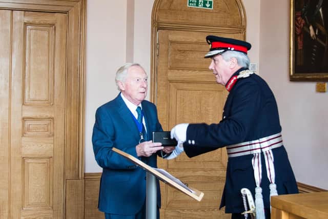 Gerry Guest receiving his MBE from the Lord Lieutenant of Warwickshire, Timothy Cox. Photo by Gill Fletcher