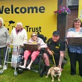 Staff and residents from Leycester House care home in Warwick recently met with some of the team from the Dogs Trust to present the donation. Photo supplied