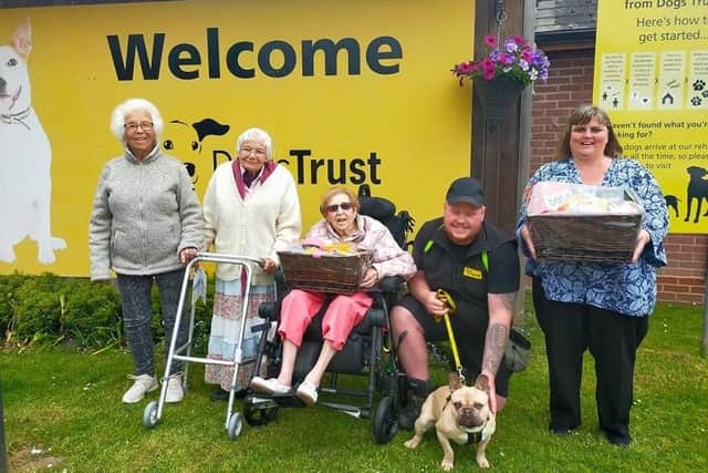 Staff and residents from Leycester House care home in Warwick recently met with some of the team from the Dogs Trust to present the donation. Photo supplied