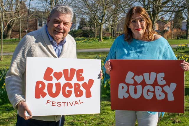 Cllr Neil Sandison and Cllr Maggie O'Rourke celebrate the launch of the Love Rugby Festival with the new Love Rugby and Love Rugby Festival logos.