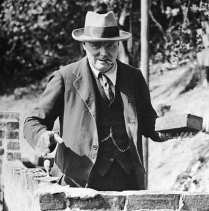 Winston Churchill carrying out some brick work at his home in Chartwell, Kent, in 1928 (photo: Getty Images)