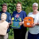 Steve Taylor, Gill Cleeve and Jo Carroll with the new defibrillator. Photo by David Fawbert Photography